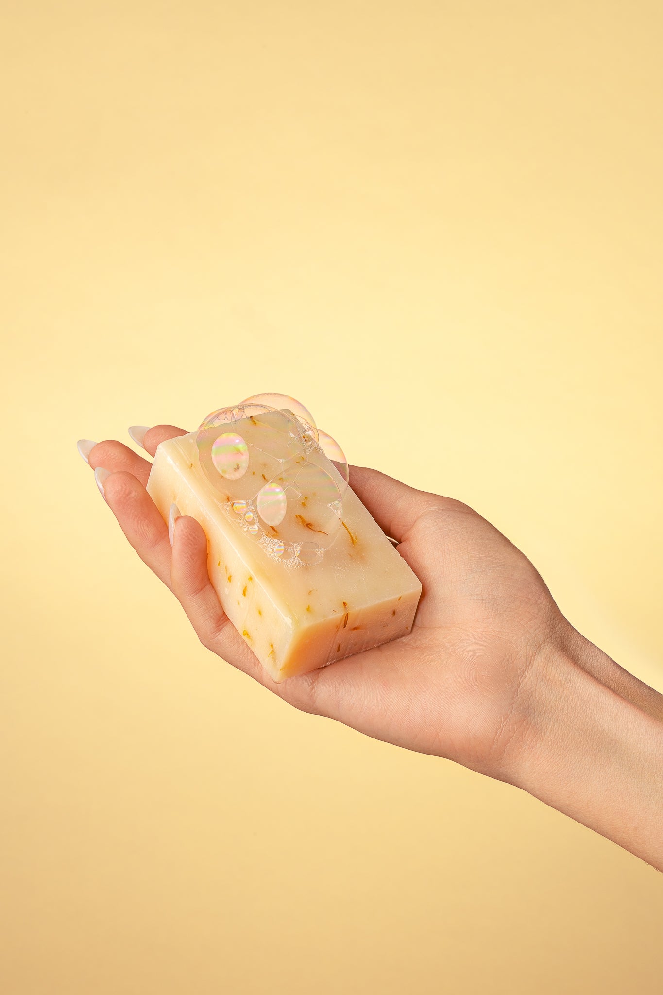 hand holding True Friend sage breeze soap bar